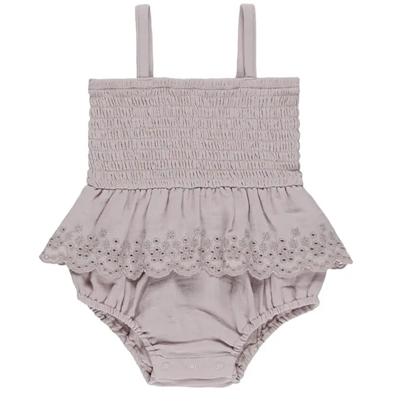 Smocked Skirted Romper in Lavender by Quincy Mae